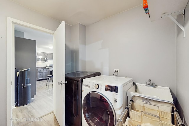 24452 W Blvd Dejohn, Naperville, IL 60564 - laundry area with washing machine and dryer and light wood finished floors