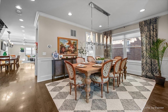 2426 W Warner Ave, Chicago, IL 60618 - dining area with recessed lighting, a chandelier, ornamental molding, and wood finished floors