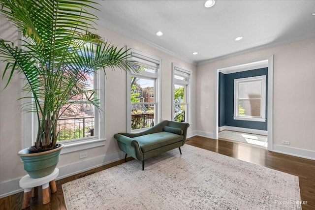 2426 W Warner Ave, Chicago, IL 60618 - sitting room with ornamental molding, plenty of natural light, wood finished floors, baseboards, and recessed lighting
