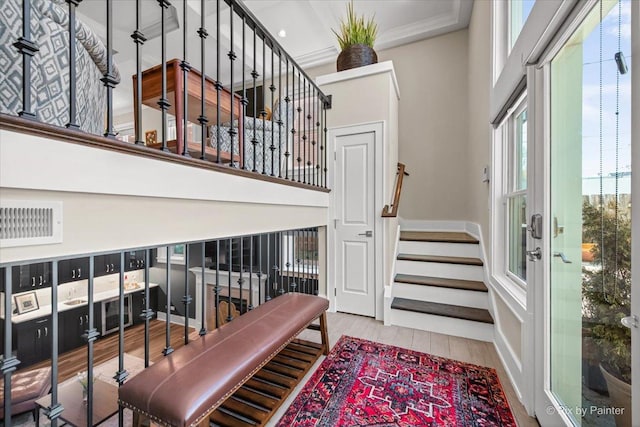 2426 W Warner Ave, Chicago, IL 60618 - foyer with stairs, wood finished floors, and a high ceiling