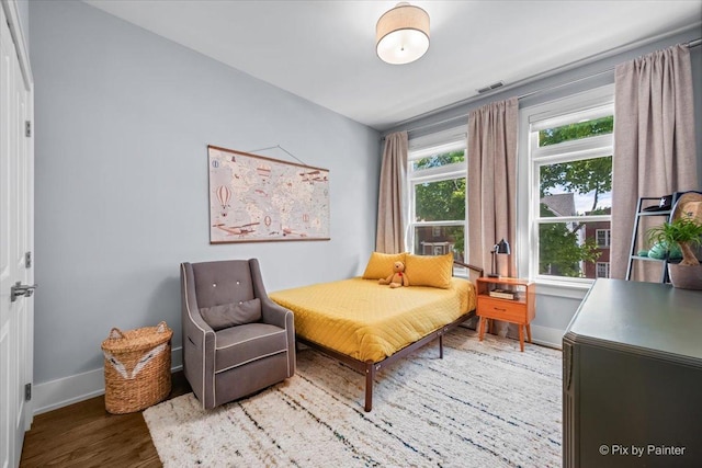 2426 W Warner Ave, Chicago, IL 60618 - bedroom with baseboards and wood finished floors
