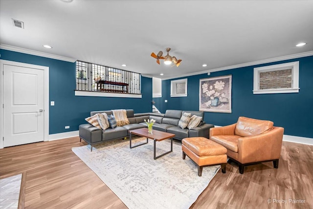 2426 W Warner Ave, Chicago, IL 60618 - living area with baseboards, crown molding, wood finished floors, and recessed lighting