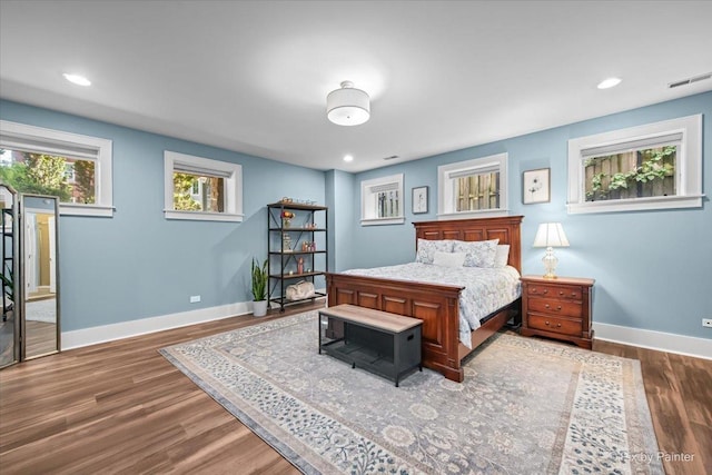 2426 W Warner Ave, Chicago, IL 60618 - bedroom featuring baseboards, wood finished floors, and recessed lighting