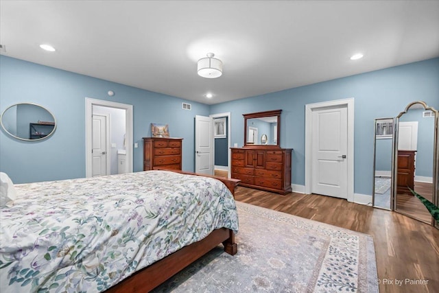 2426 W Warner Ave, Chicago, IL 60618 - bedroom with wood finished floors, baseboards, and recessed lighting