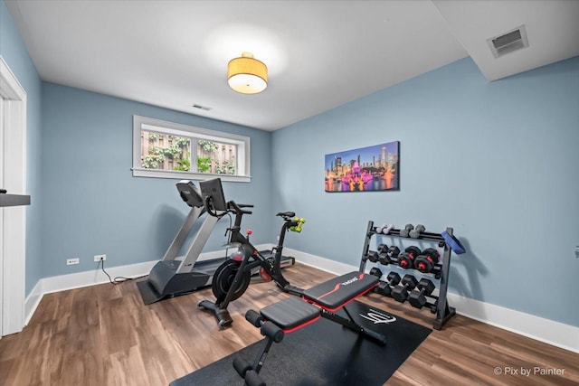 2426 W Warner Ave, Chicago, IL 60618 - workout area featuring wood finished floors and baseboards