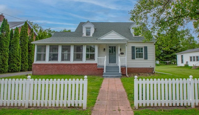 110 N Newton St, Goodland, IN 47948 - new england style home featuring roof with shingles and a sunroom
