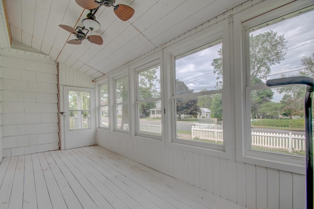 110 N Newton St, Goodland, IN 47948 - unfurnished sunroom with healthy amount of natural light, ceiling fan, and lofted ceiling