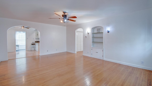 110 N Newton St, Goodland, IN 47948 - unfurnished room featuring arched walkways, ceiling fan, and built in features