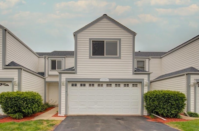1716 Waters Edge Dr Unit 1716, Minooka, IL 60447 - traditional-style house featuring asphalt driveway and a garage