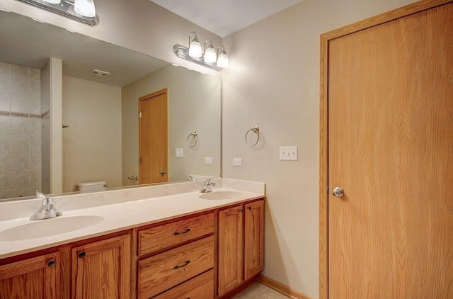 1716 Waters Edge Dr Unit 1716, Minooka, IL 60447 - bathroom featuring double vanity and toilet