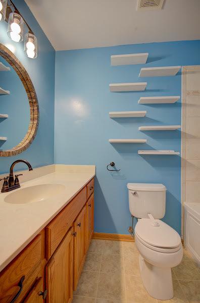 1716 Waters Edge Dr Unit 1716, Minooka, IL 60447 - full bath featuring vanity, toilet, tile patterned flooring, and baseboards