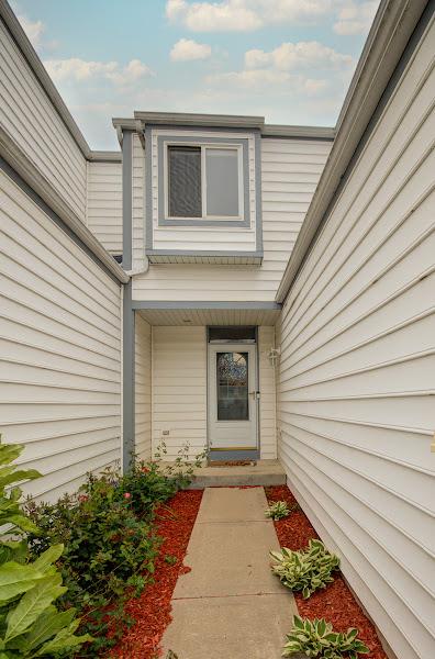 1716 Waters Edge Dr Unit 1716, Minooka, IL 60447 - view of doorway to property