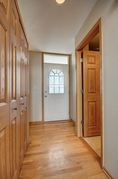 1716 Waters Edge Dr Unit 1716, Minooka, IL 60447 - entryway featuring light wood-type flooring and baseboards
