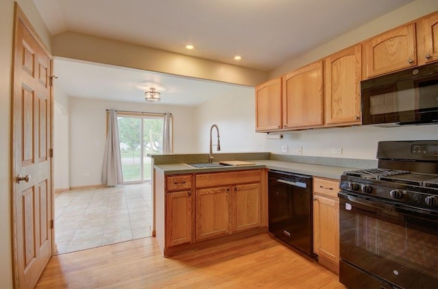 1716 Waters Edge Dr Unit 1716, Minooka, IL 60447 - kitchen featuring black appliances, a sink, a peninsula, light wood-style flooring, and recessed lighting