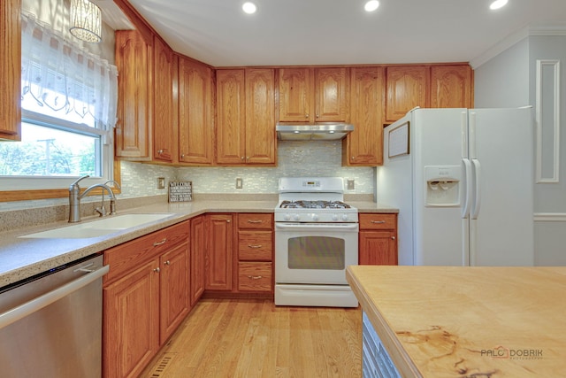 14 Wander Way, Lake In The Hills, IL 60156 - kitchen featuring white appliances, a sink, under cabinet range hood, light countertops, and recessed lighting