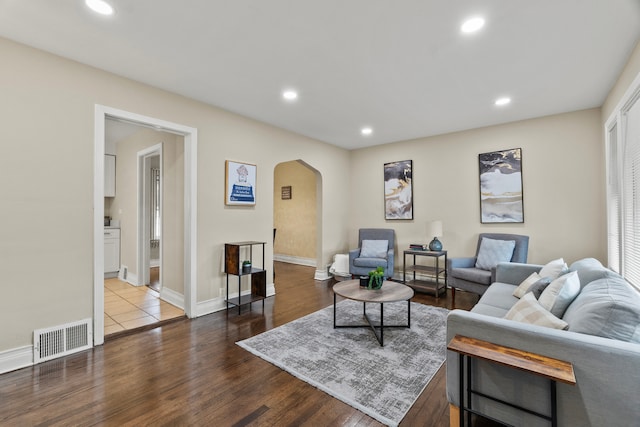 9026 S Colfax Ave, Chicago, IL 60617 - living area featuring arched walkways, recessed lighting, wood finished floors, and baseboards
