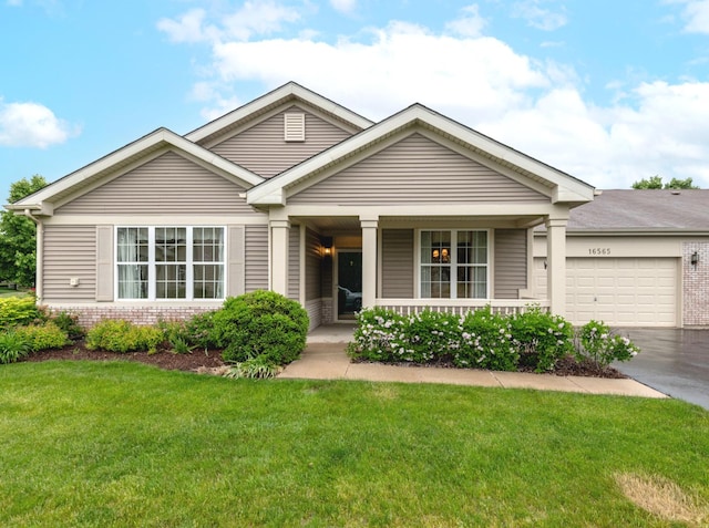 16565 Buckner Pond Way, Crest Hill, IL 60403 - view of front of property featuring brick siding, covered porch, a garage, and a front lawn