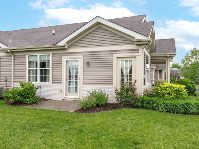 16565 Buckner Pond Way, Crest Hill, IL 60403 - rear view of house featuring a lawn and a shingled roof