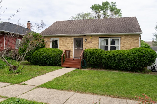 431 Griswold St, Elgin, IL 60123 - view of front of home featuring a front lawn and roof with shingles
