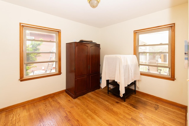 431 Griswold St, Elgin, IL 60123 - bedroom featuring multiple windows, light wood-style flooring, and baseboards