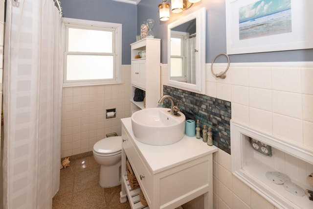 431 Griswold St, Elgin, IL 60123 - bathroom featuring tile walls, vanity, tile patterned flooring, toilet, and curtained shower
