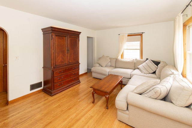 431 Griswold St, Elgin, IL 60123 - living room with light wood-style floors, arched walkways, and baseboards