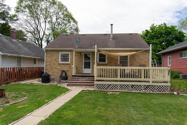 431 Griswold St, Elgin, IL 60123 - rear view of house with brick siding, a deck, and roof with shingles