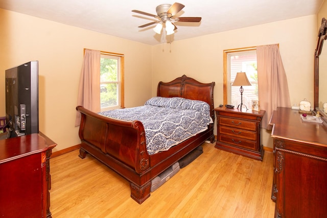 431 Griswold St, Elgin, IL 60123 - bedroom with light wood finished floors, baseboards, and a ceiling fan