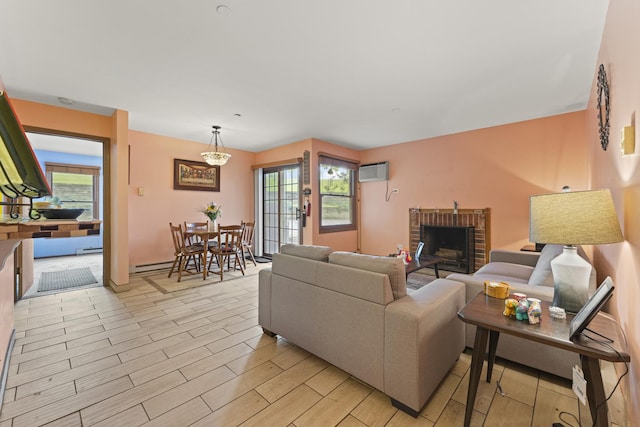 1384 Cunat Ct Unit 1B, Lake In The Hills, IL 60156 - living area featuring a wall mounted AC, plenty of natural light, a brick fireplace, and light wood-style floors