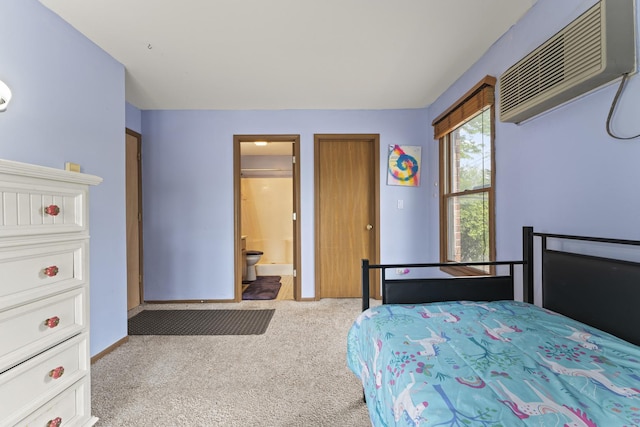1384 Cunat Ct Unit 1B, Lake In The Hills, IL 60156 - carpeted bedroom featuring an AC wall unit, ensuite bathroom, and baseboards