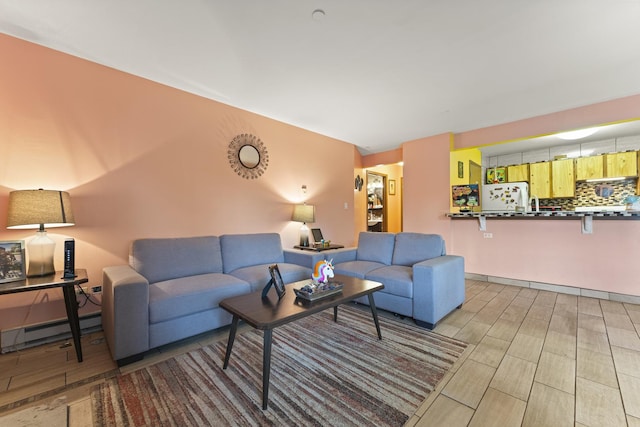 1384 Cunat Ct Unit 1B, Lake In The Hills, IL 60156 - living room with a baseboard heating unit and wood finished floors