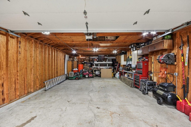 4N221 7th Ave, Addison, IL 60101 - garage with a garage door opener and wooden walls