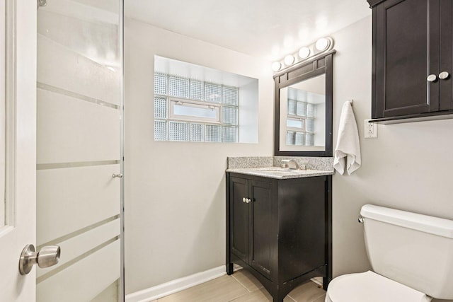 2741 N 75th Ave, Elmwood Park, IL 60707 - full bath with toilet, vanity, baseboards, and a shower