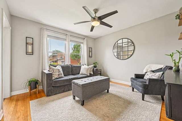 2741 N 75th Ave, Elmwood Park, IL 60707 - living room with baseboards, ceiling fan, and light wood-style flooring