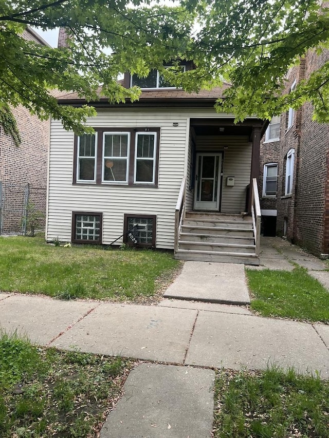 8029 S Houston Ave, Chicago, IL 60617 - view of front of home featuring a front yard