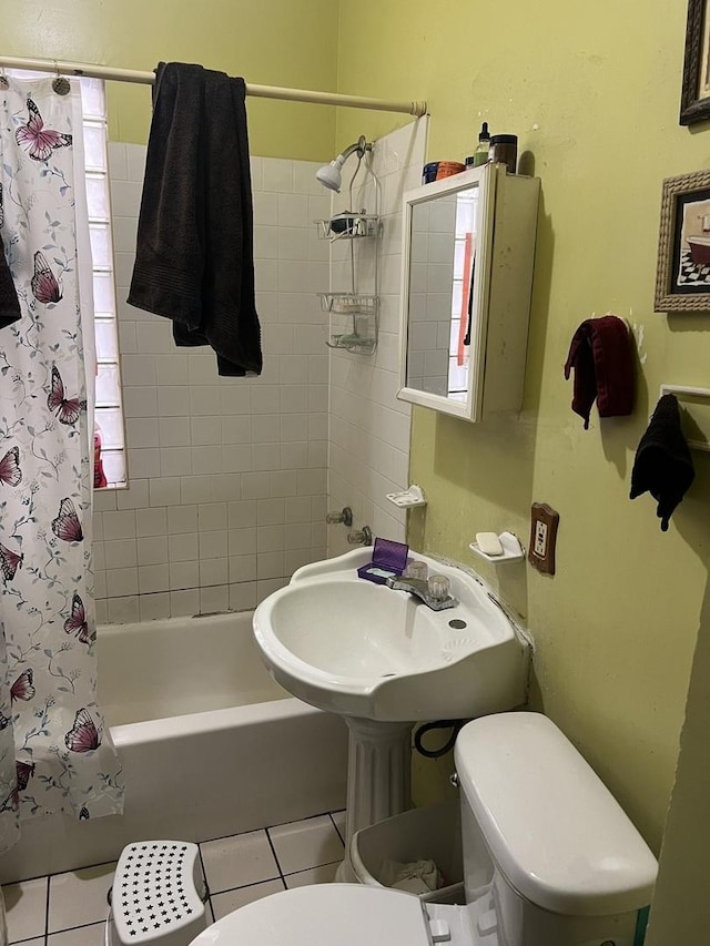 8029 S Houston Ave, Chicago, IL 60617 - bathroom with toilet, shower / tub combo with curtain, tile patterned flooring, and a sink