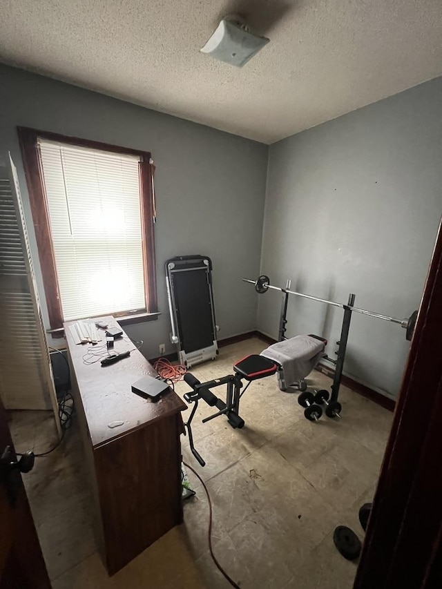 8029 S Houston Ave, Chicago, IL 60617 - office area featuring a textured ceiling and baseboards