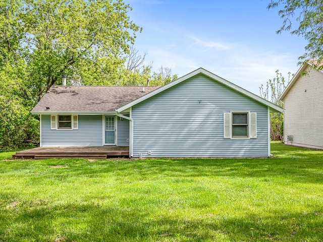 119 SE Brandywine Dr, Poplar Grove, IL 61065 - rear view of house featuring a yard, a deck, and roof with shingles