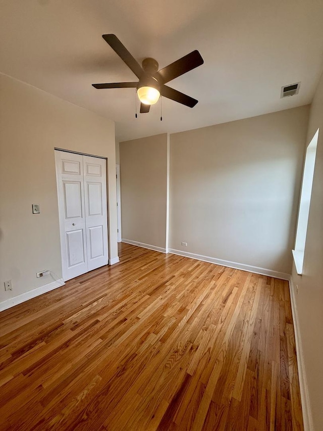 6324 S Kimbark Ave Unit 404, Chicago, IL 60637 - unfurnished bedroom featuring light wood-style flooring, ceiling fan, baseboards, and a closet