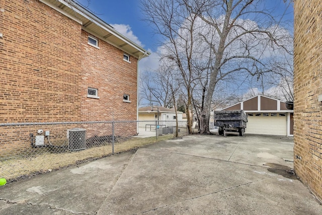 2004 Linden Ave, Park Ridge, IL 60068 - view of home's exterior featuring brick siding, cooling unit, an outbuilding, and driveway