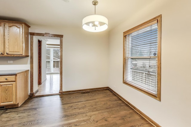 2004 Linden Ave, Park Ridge, IL 60068 - unfurnished dining area with dark wood-type flooring and baseboards
