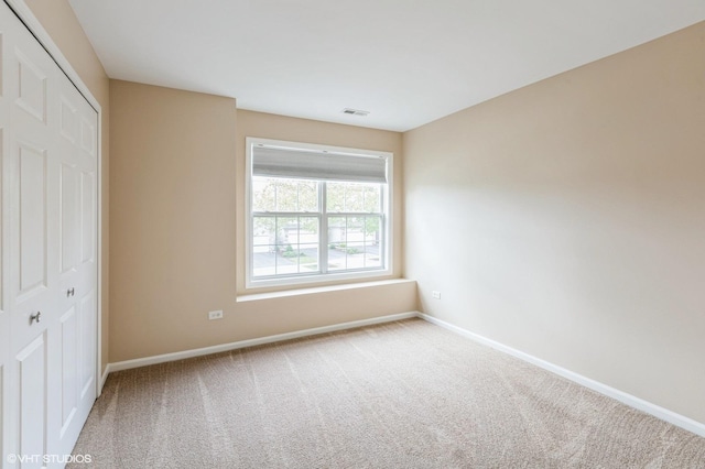 1708 S Fieldstone Dr, Shorewood, IL 60404 - unfurnished bedroom with baseboards, carpet floors, and a closet