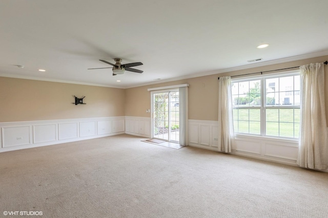 1708 S Fieldstone Dr, Shorewood, IL 60404 - spare room with light colored carpet, a ceiling fan, crown molding, a decorative wall, and recessed lighting