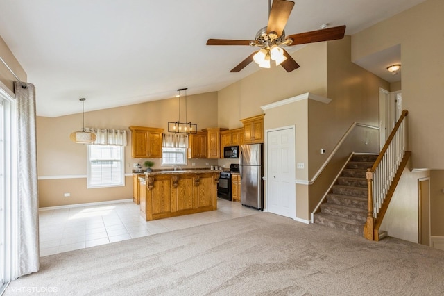 1708 S Fieldstone Dr, Shorewood, IL 60404 - kitchen featuring black appliances, lofted ceiling, a kitchen island, brown cabinets, and baseboards