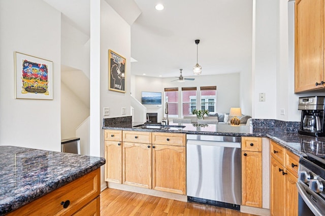 7511 Brown Ave Unit N, Forest Park, IL 60130 - kitchen featuring appliances with stainless steel finishes, light wood finished floors, a ceiling fan, dark stone counters, and recessed lighting