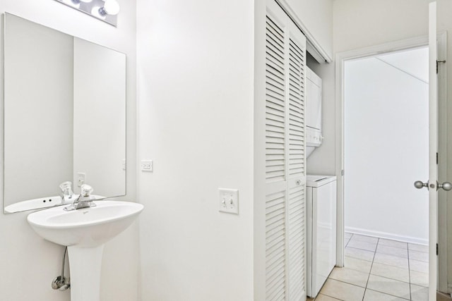7511 Brown Ave Unit N, Forest Park, IL 60130 - bathroom featuring stacked washer / drying machine, a closet, and tile patterned flooring