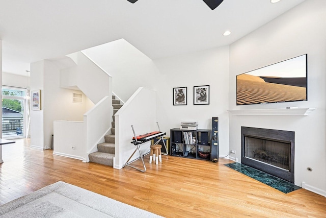 7511 Brown Ave Unit N, Forest Park, IL 60130 - living area featuring wood finished floors, a fireplace with flush hearth, stairway, recessed lighting, and ceiling fan