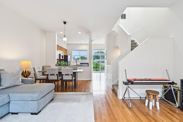 7511 Brown Ave Unit N, Forest Park, IL 60130 - living room with stairway, light wood-style flooring, and recessed lighting