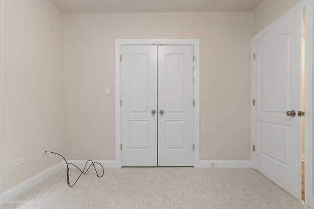 25 E 26th St Unit 4, Chicago, IL 60616 - unfurnished bedroom featuring carpet, baseboards, and a closet