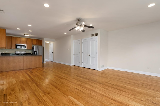 25 E 26th St Unit 4, Chicago, IL 60616 - unfurnished living room featuring recessed lighting, baseboards, light wood finished floors, and ceiling fan